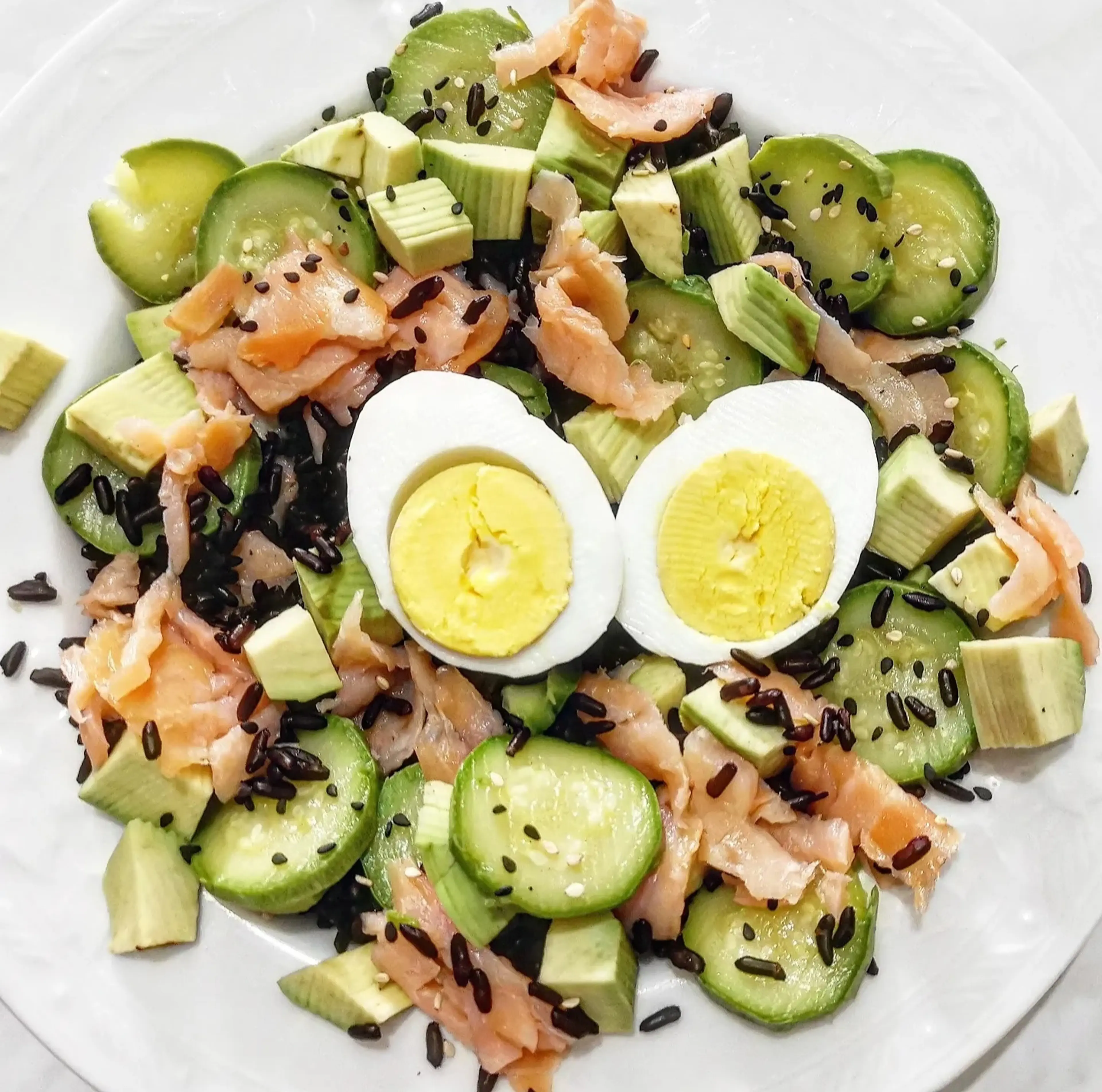 Big Salad with Black Rice, Eggs, Salmon, Avocado and Mixed Sesame Seeds