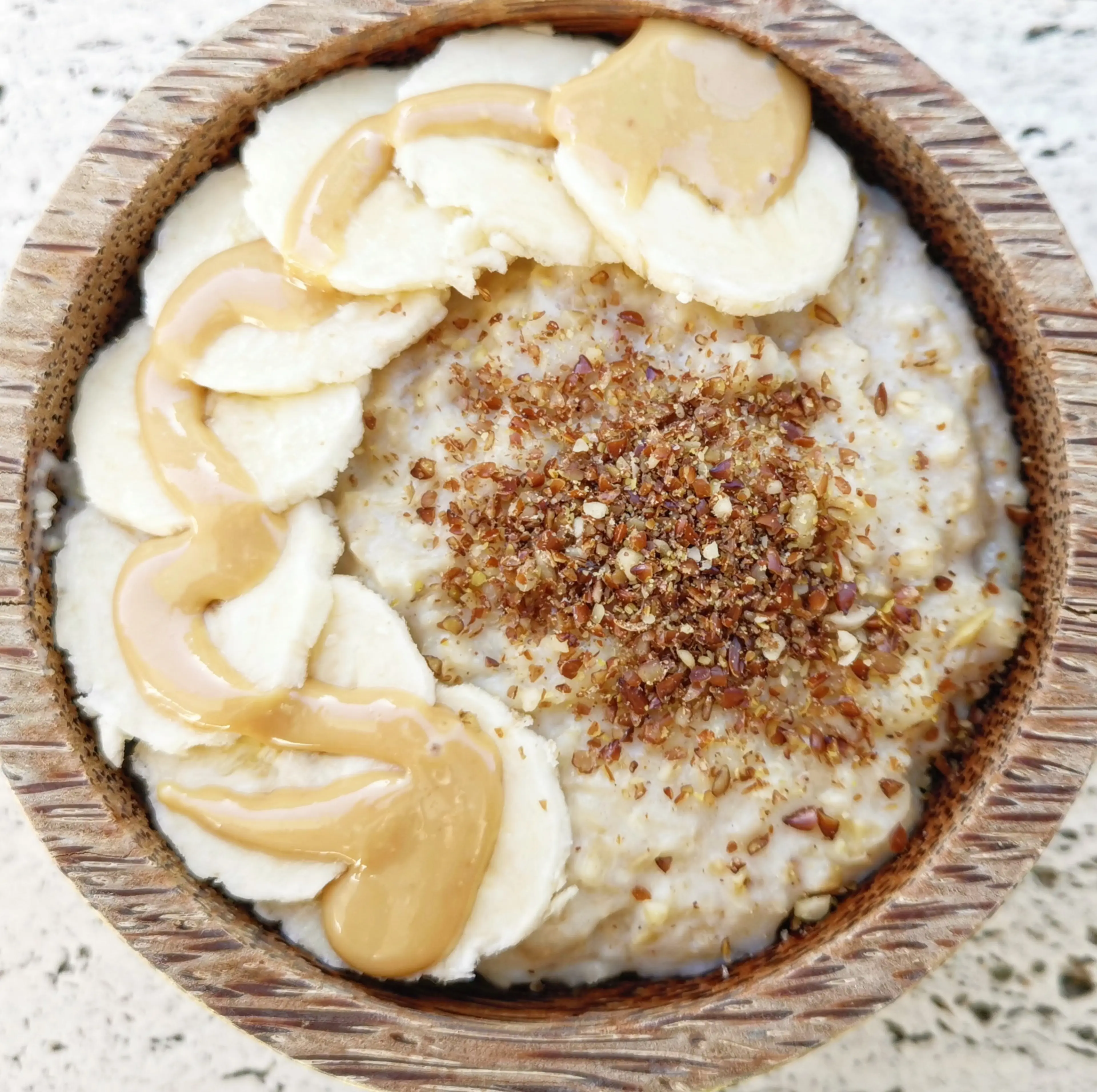 Oat Porridge with Banana, Peanut Butter and Ground Mixed Seeds