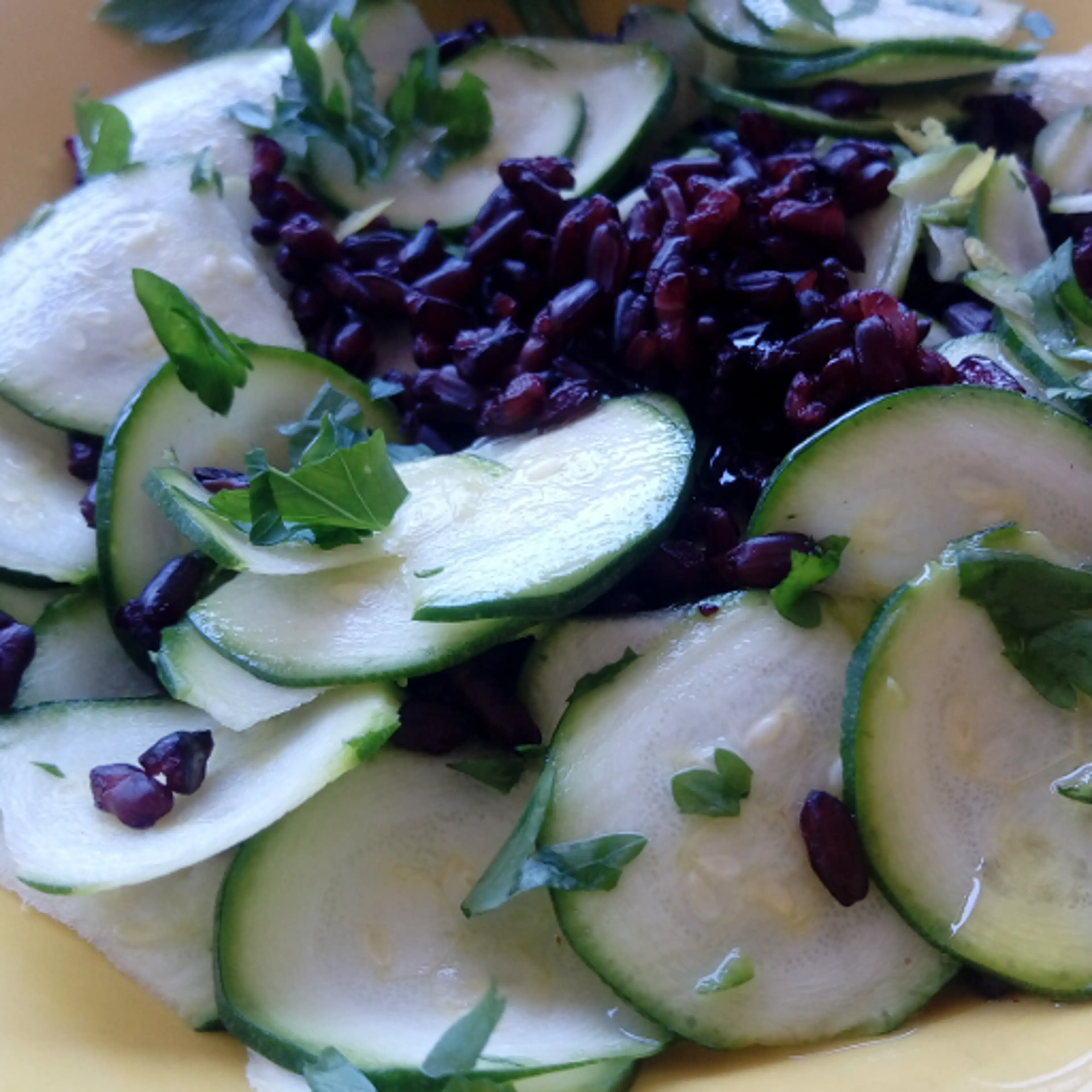 Black rice with zucchini and parsley