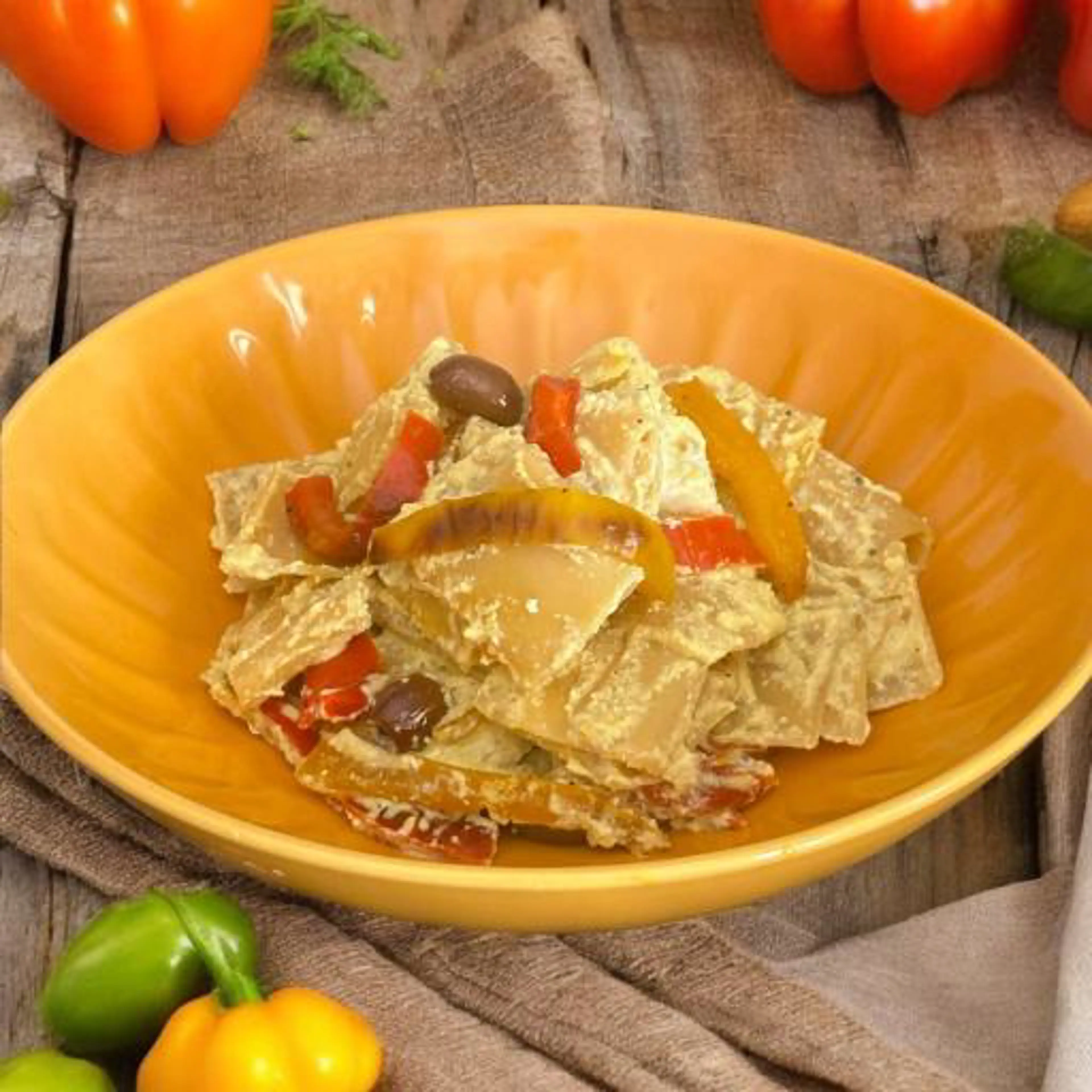 Paccheri with tofu cream, peppers, and olives