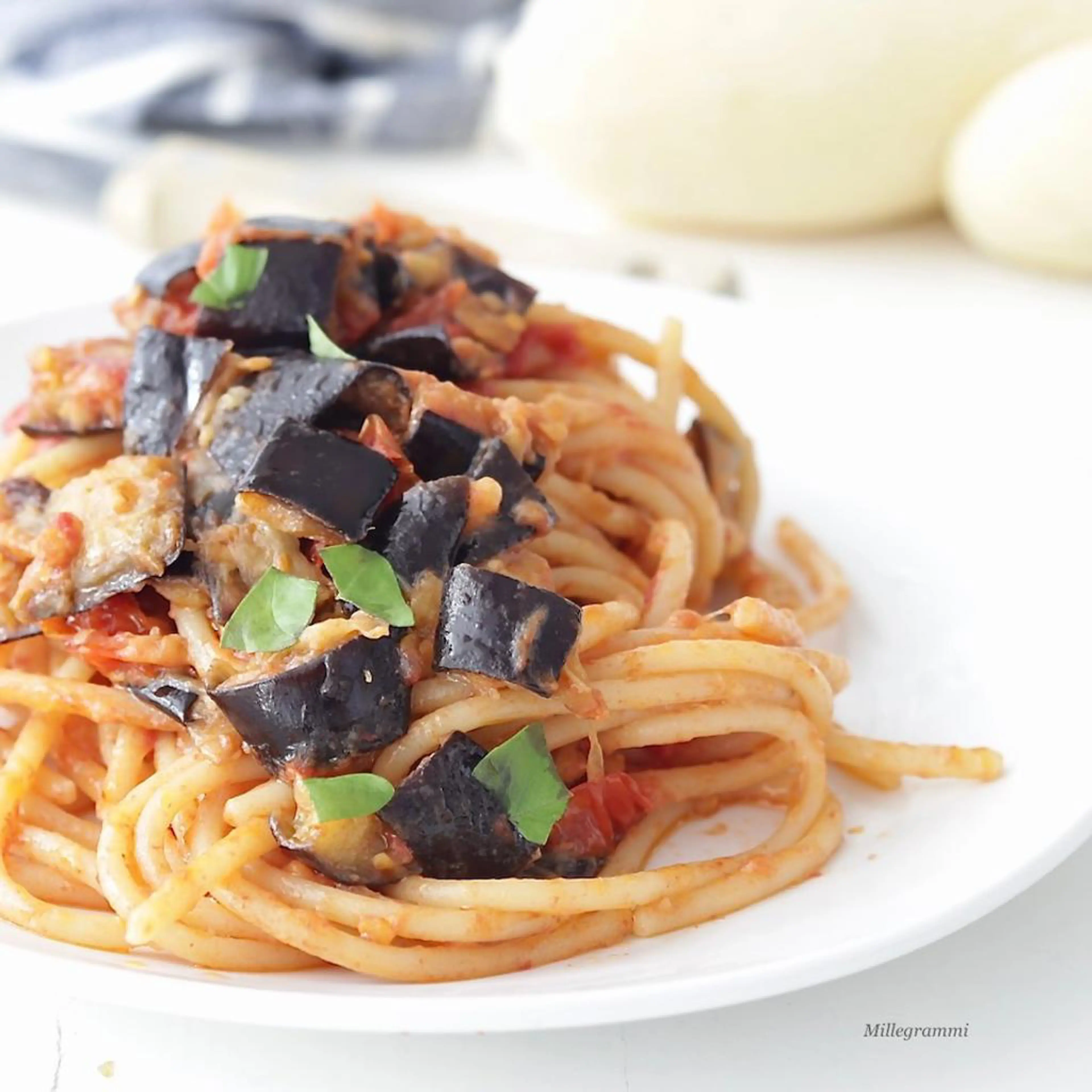 Pasta with eggplants, cherry tomatoes and caciocavallo