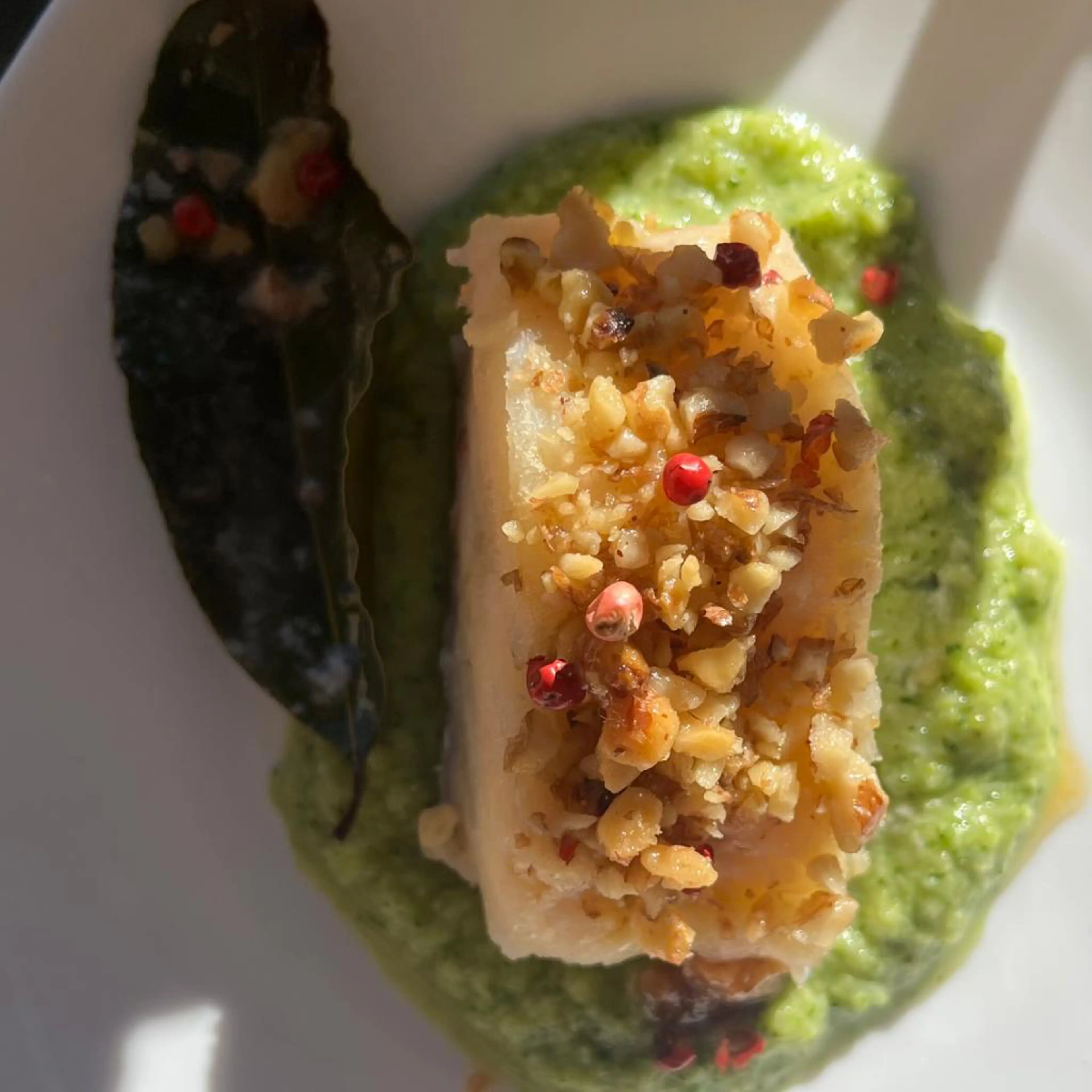 Salt cod in walnut crust on a bed of broccoli