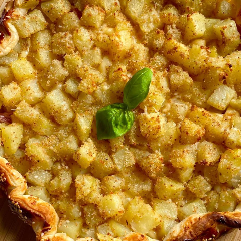 Savory pie with sandy potatoes, ham, and cheese