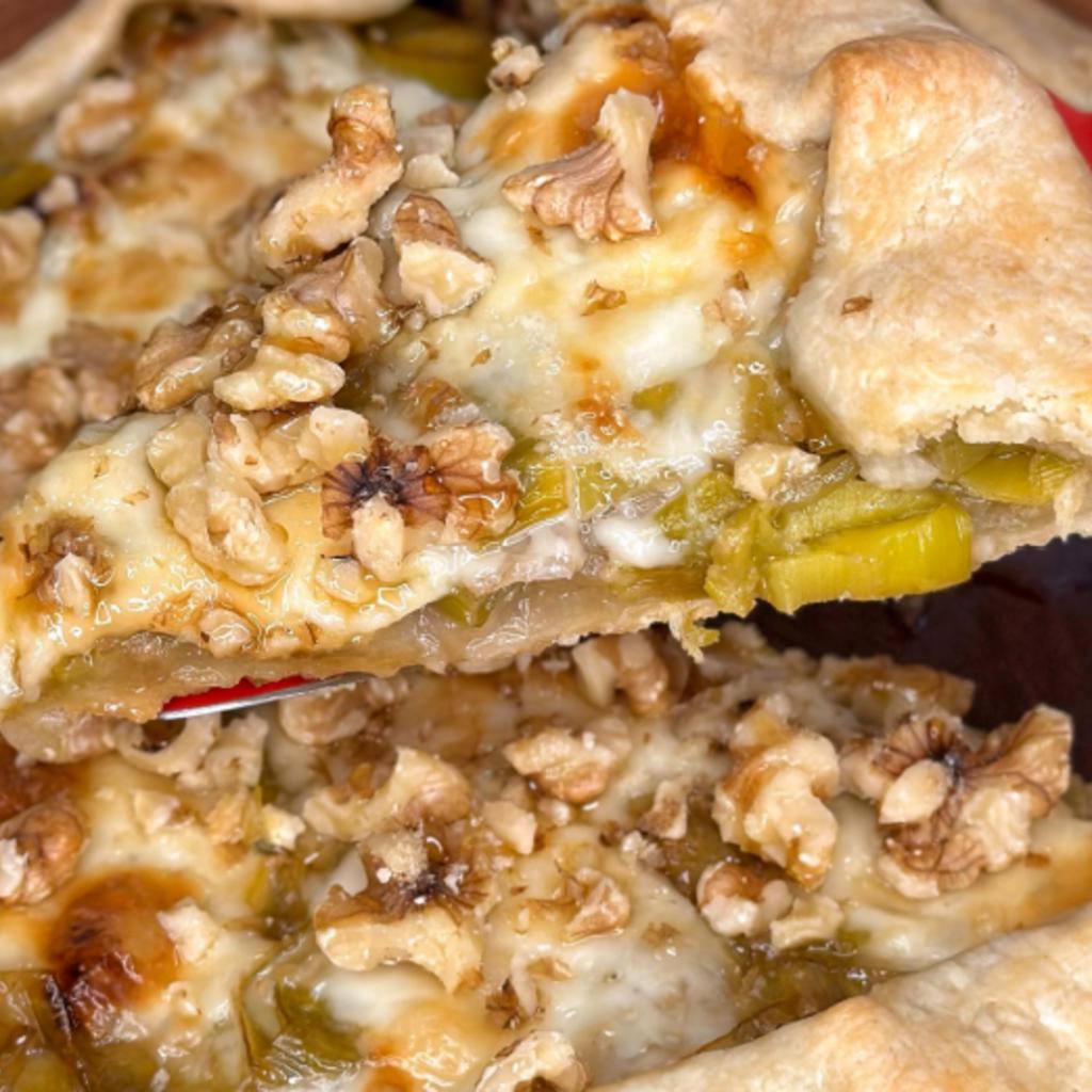 Savory tart with caramelized leeks, taleggio, walnuts and honey