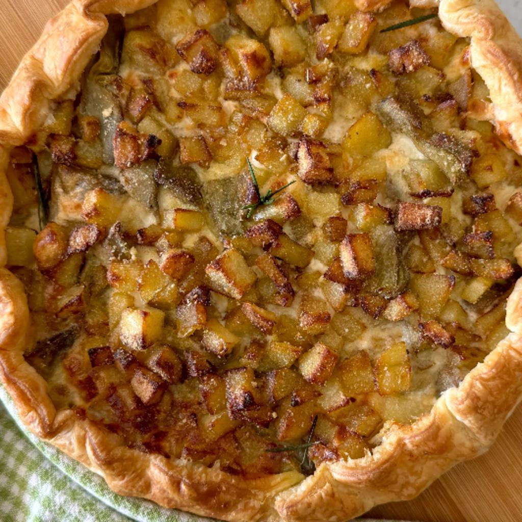 Savory pie with potatoes, artichokes, stracchino cheese, and coppa