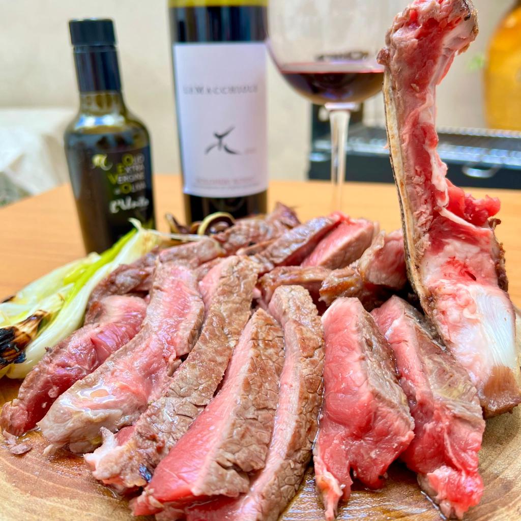 Chianina Fiorentina with grilled radicchio and spring onions