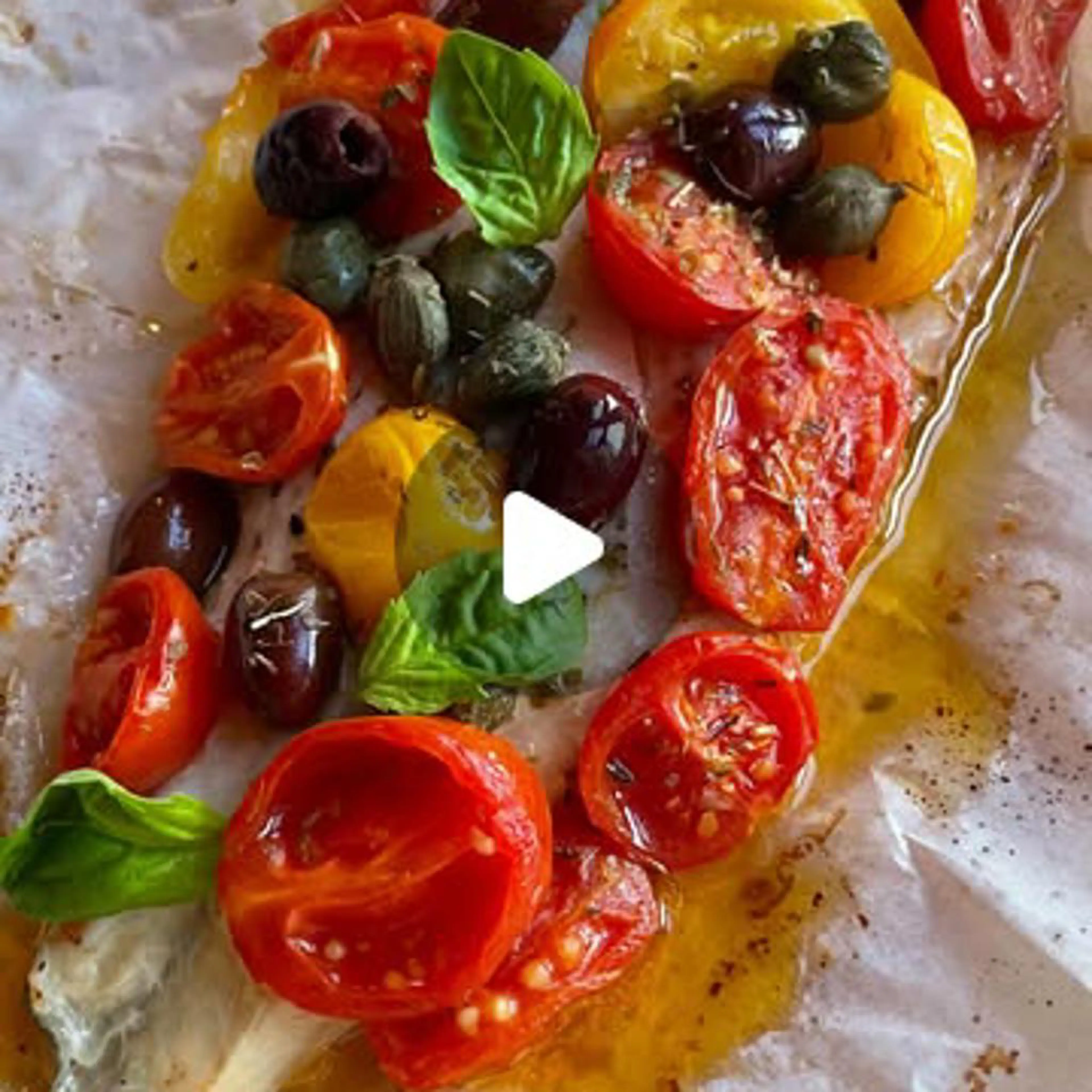 Sea bass fillets en papillote with cherry tomatoes, capers and Taggiasca olives