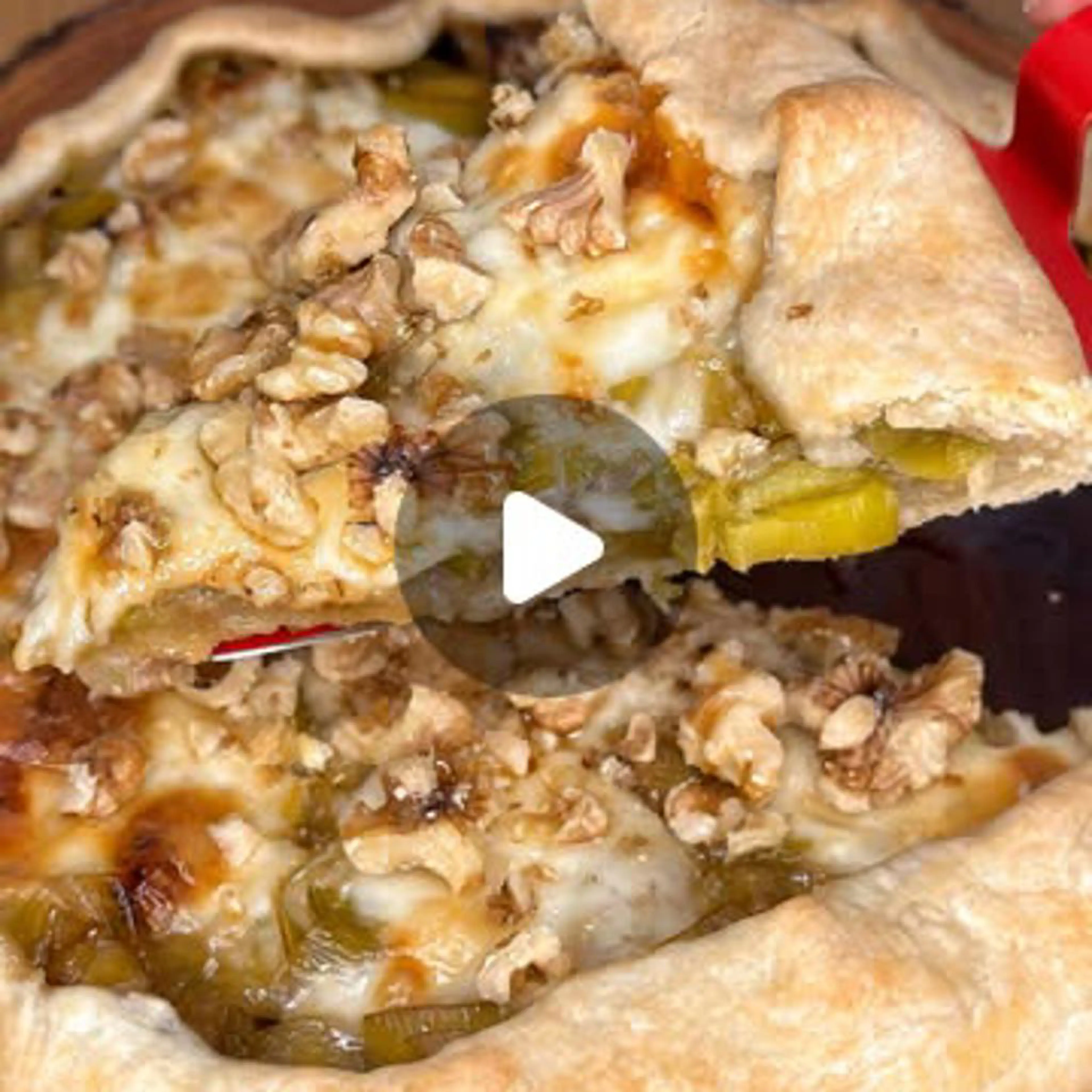 Savory tart with caramelized leeks, taleggio, walnuts, and honey