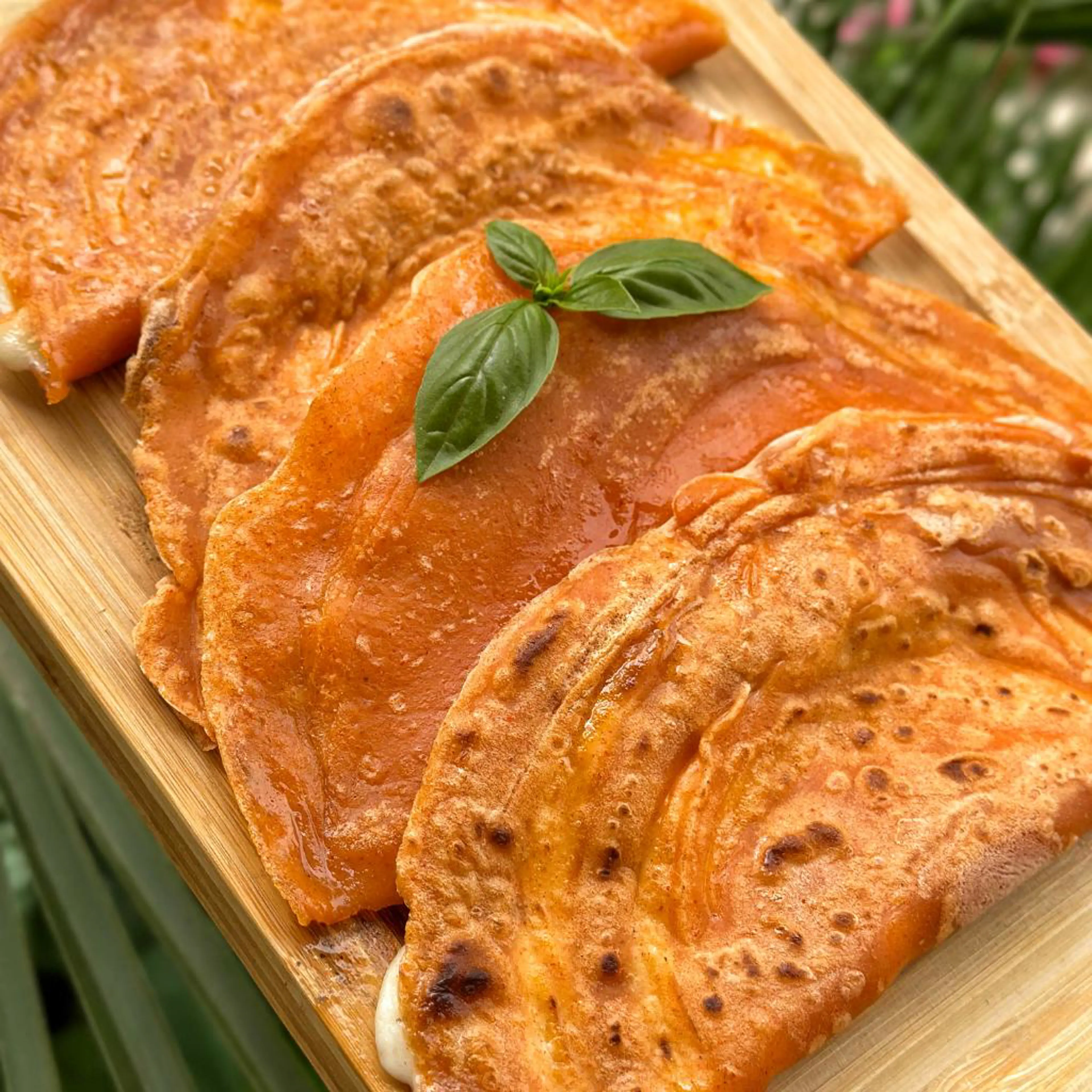 Water crêpe half-moons with a stringy cheese filling