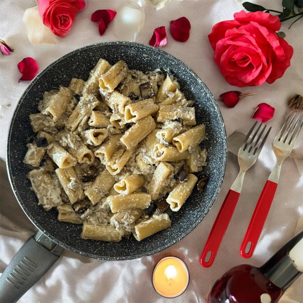 Heart-shaped pasta with eggplant, ground meat, and buffalo provola