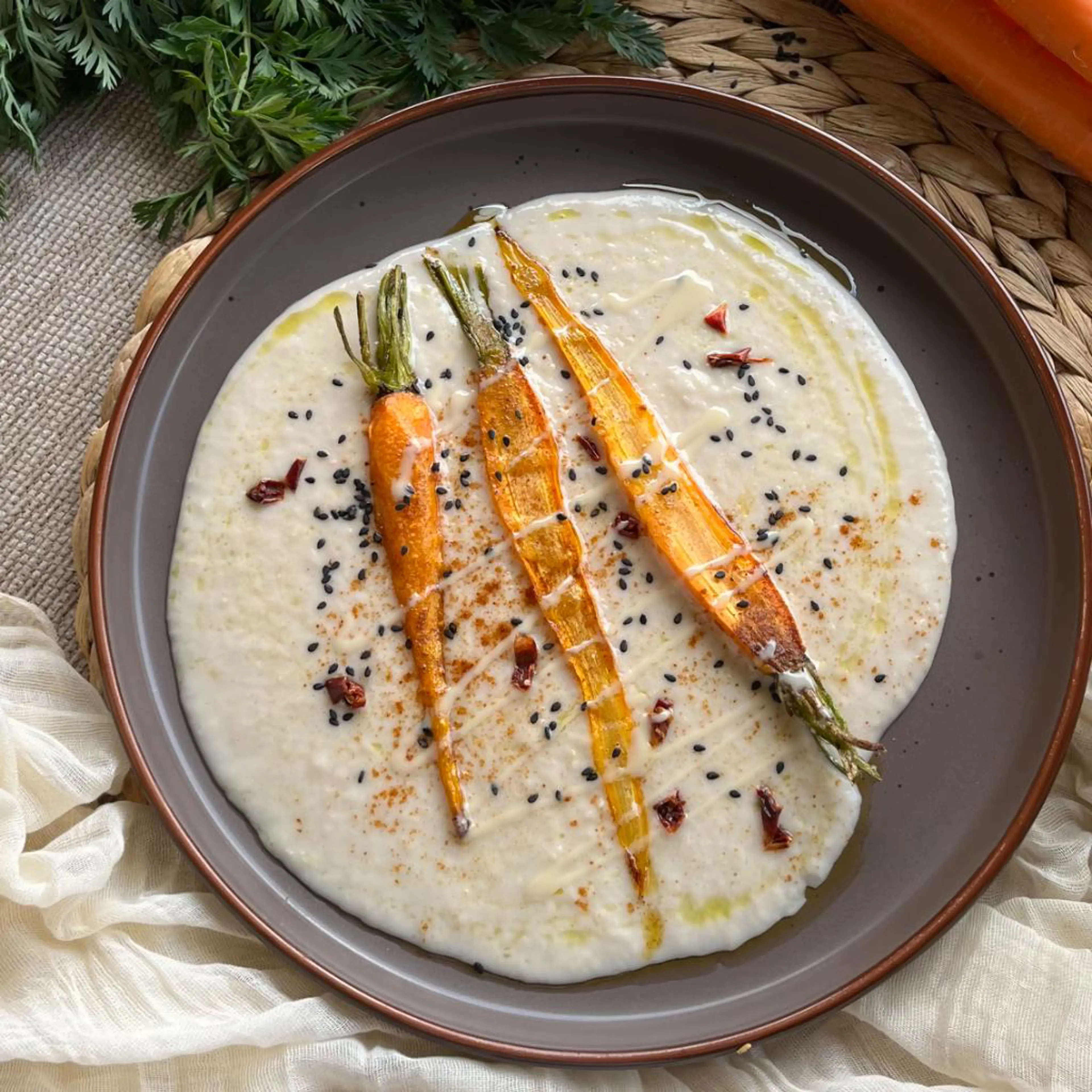 Cannellini hummus with almond cream and spiced carrots