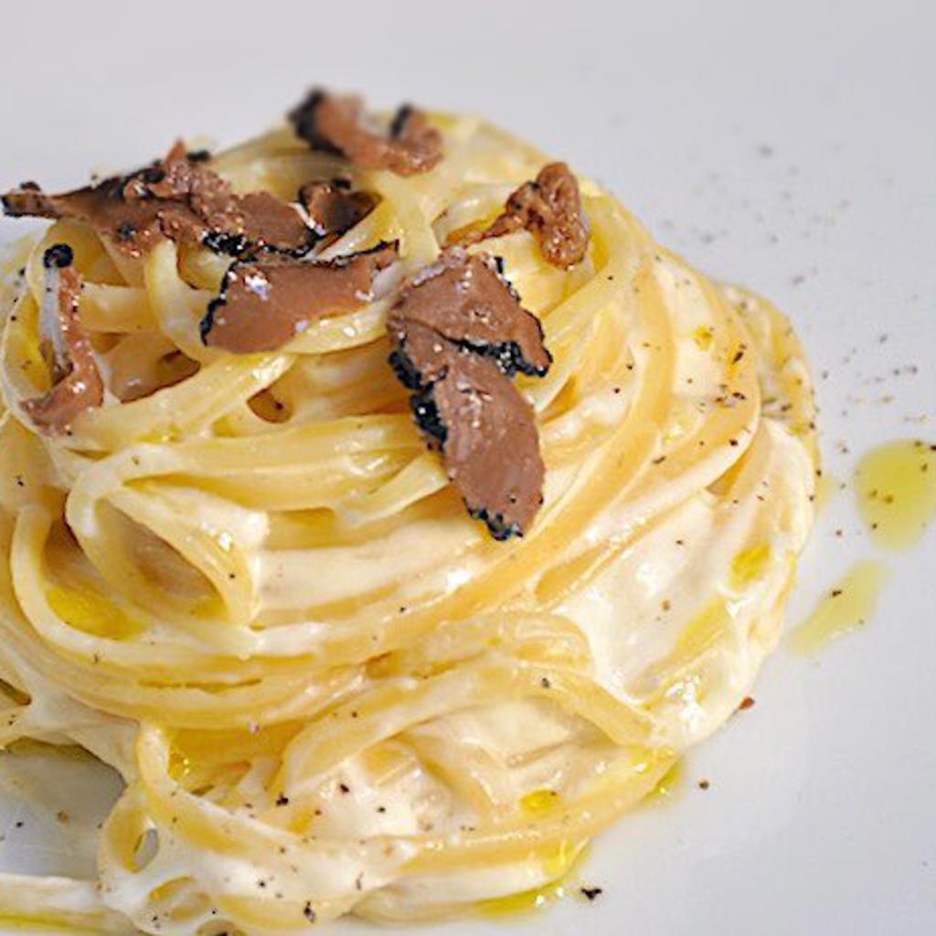 Egg tagliolini with burrata and black truffle