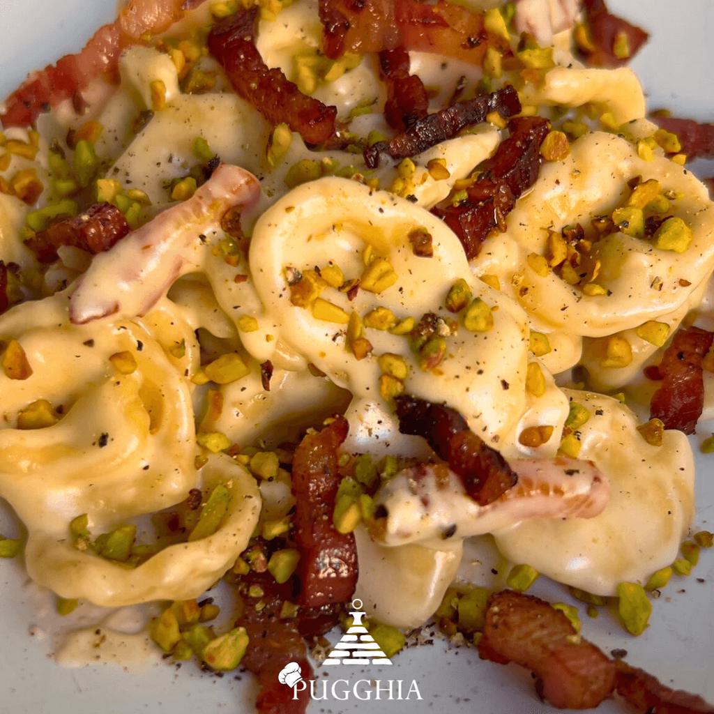 Orecchiette with wine, pancetta, stracchino, and pistachios