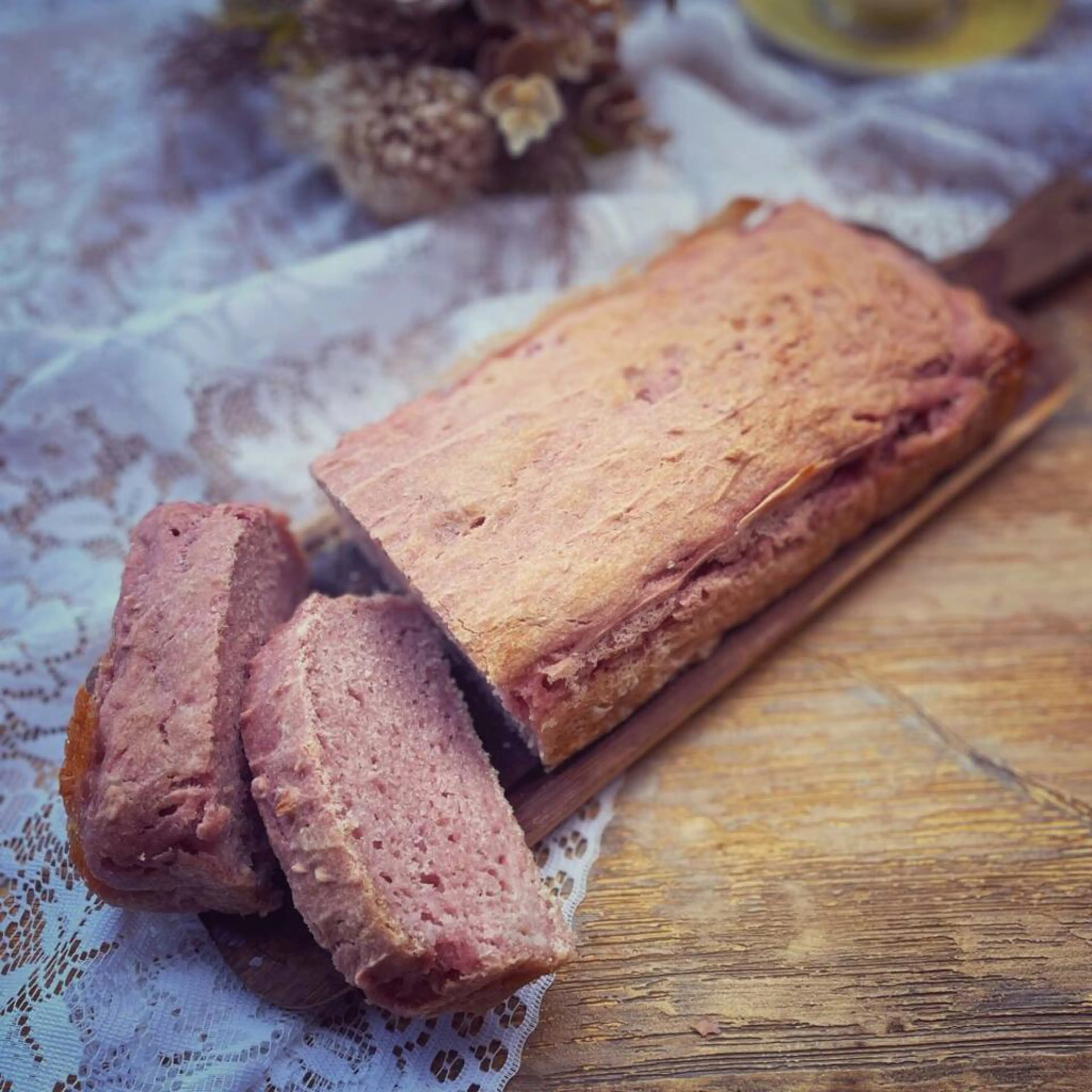 Gluten-free loaf bread with raspberry coulis