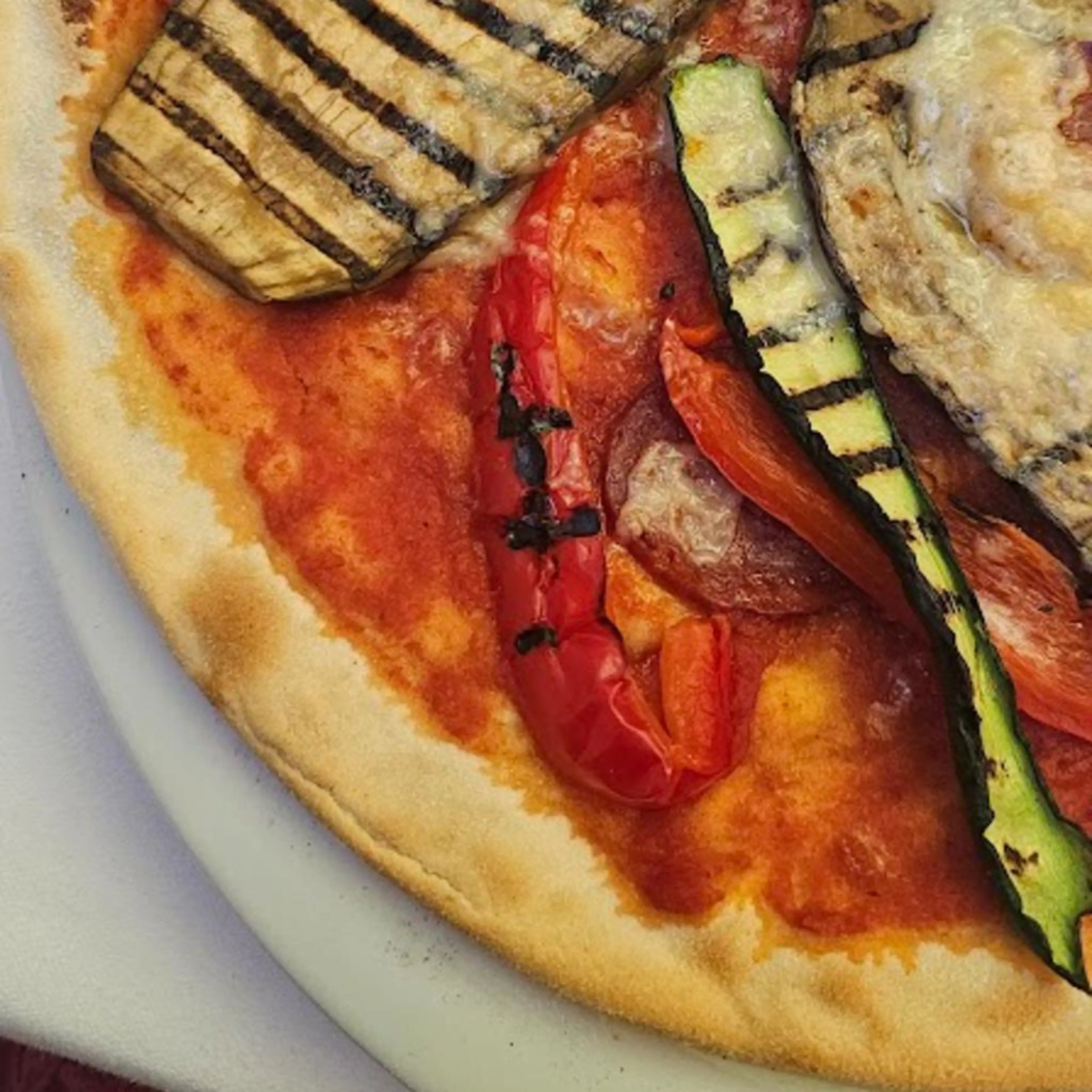 Gluten-free and lactose-free pizza with a tall, crispy crust