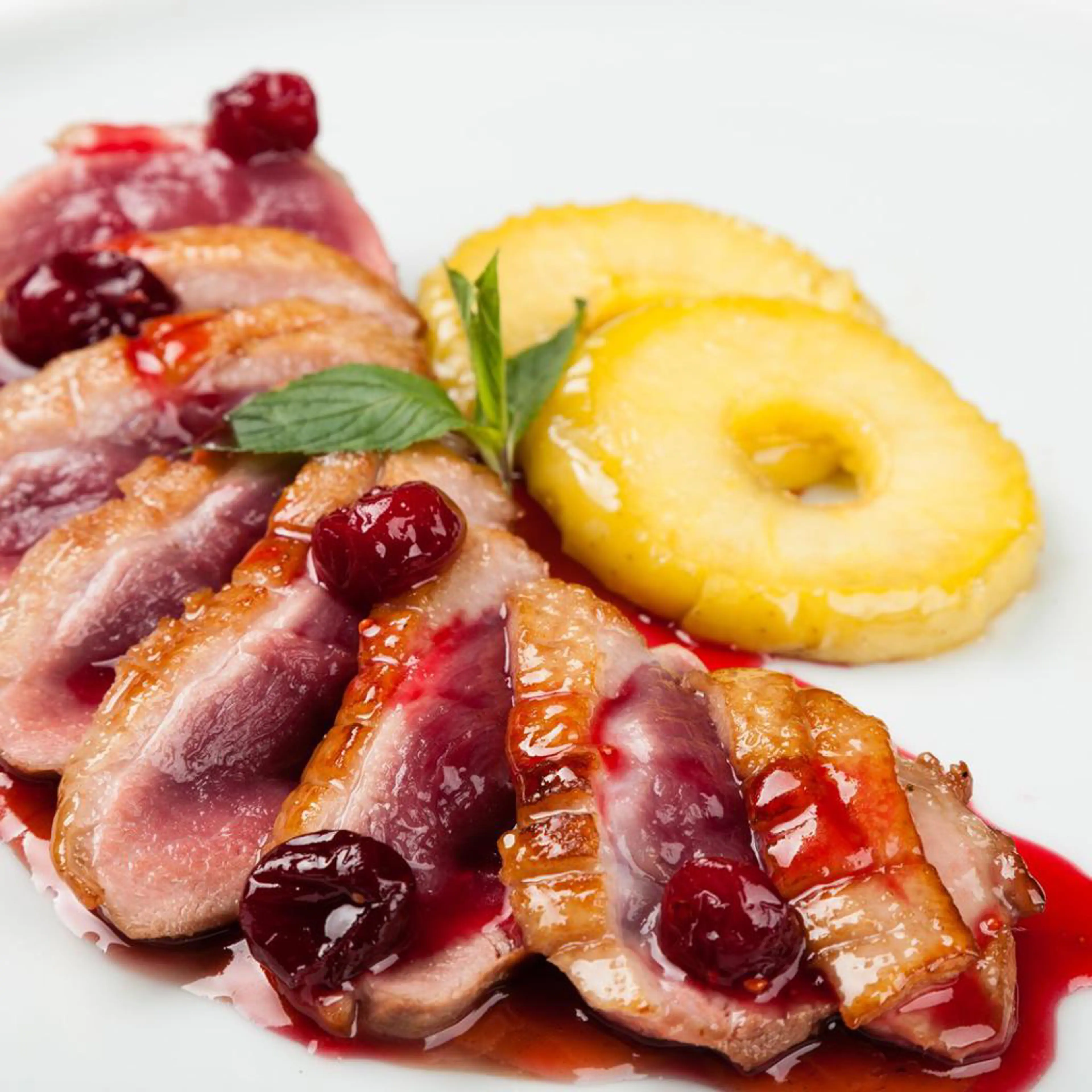 Pato com porto e cerejas